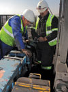 Field services technicians conduct on-site condition monitoring using laser alignment of equipment.